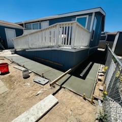 concrete sidewalk being created by mobile home